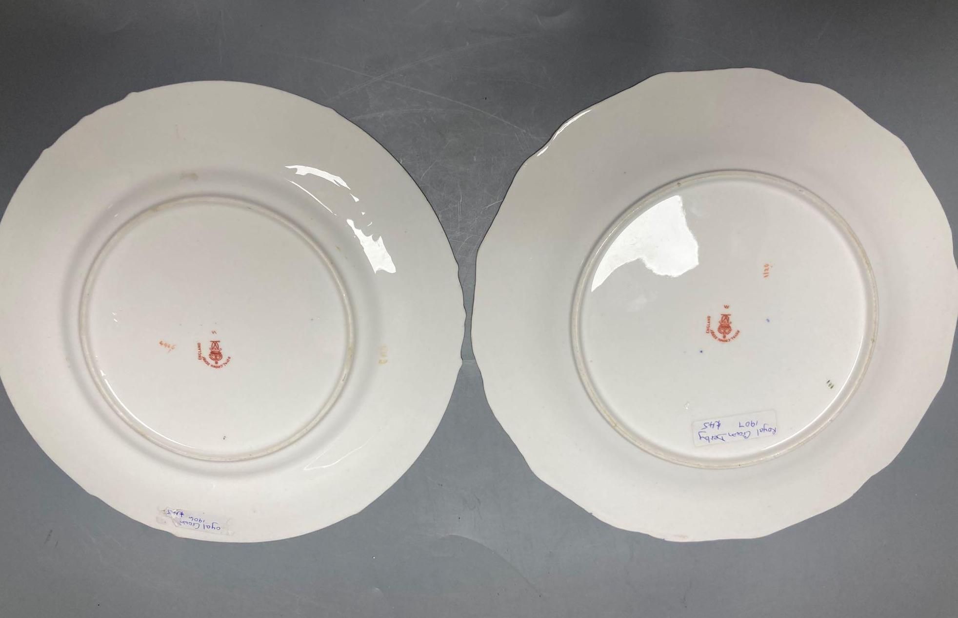 Two Royal Crown Derby Imari pattern plates, three Crown Derby plates or saucers, a Royal Crown Derby cup and two saucers and two Red Av